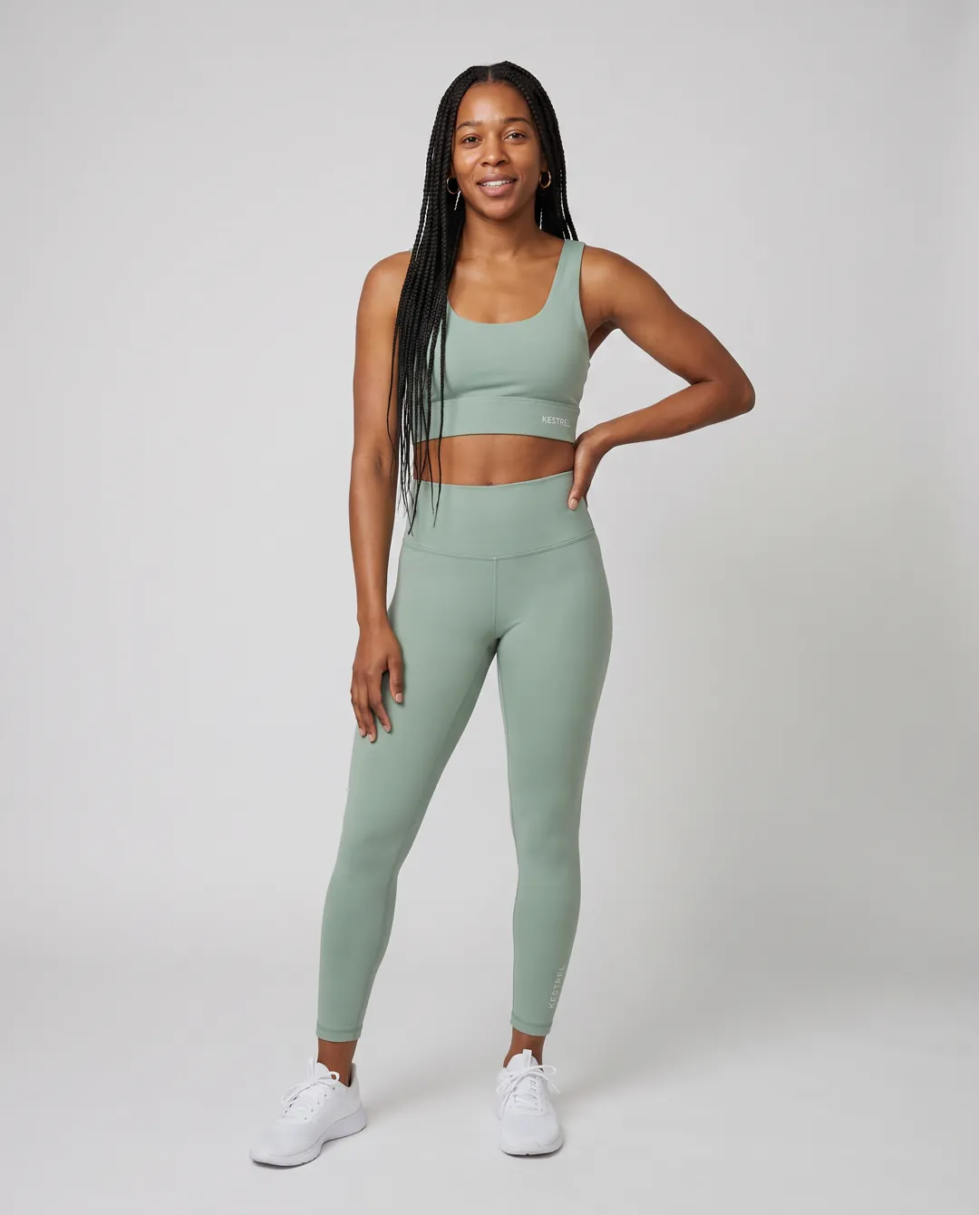 Activewear e-commerce shot on a grey seamless backdrop