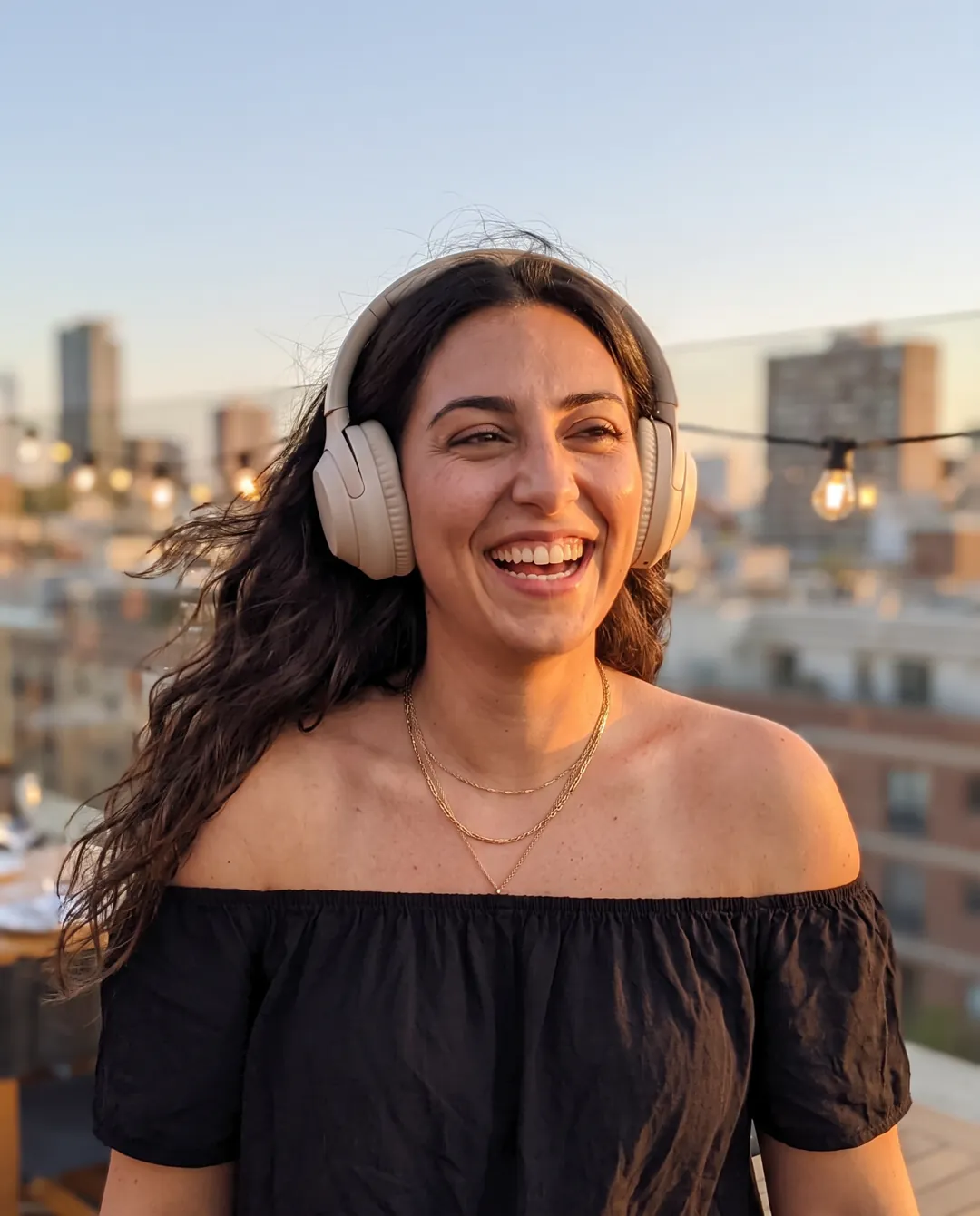 Rooftop post wearing headphones