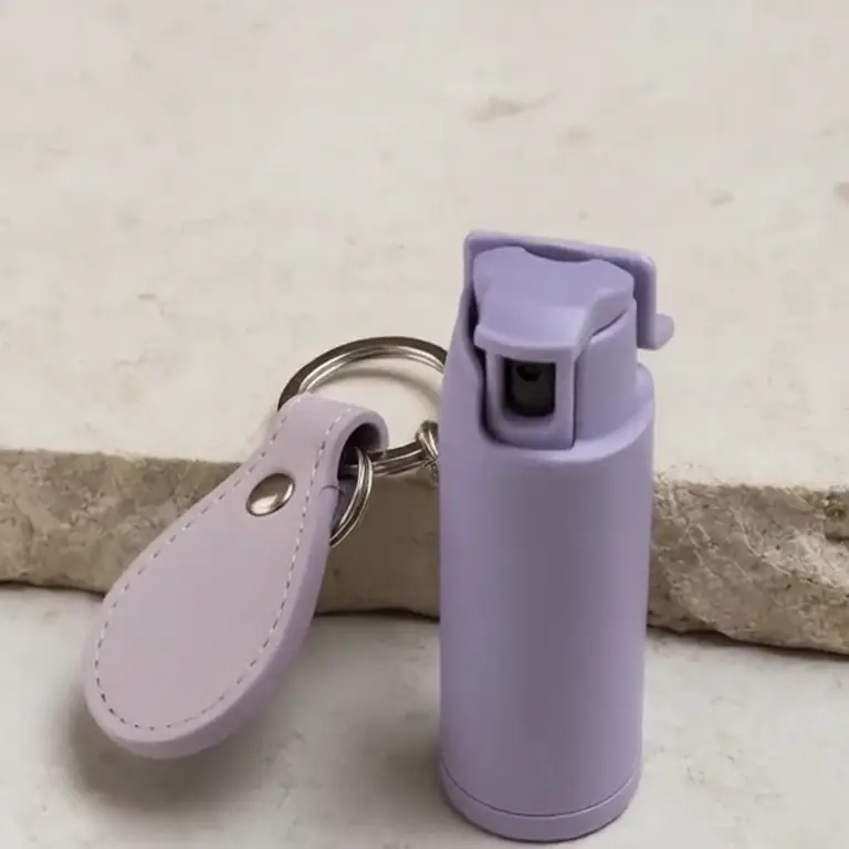 Motion product shot: pepper spray keychain, product only